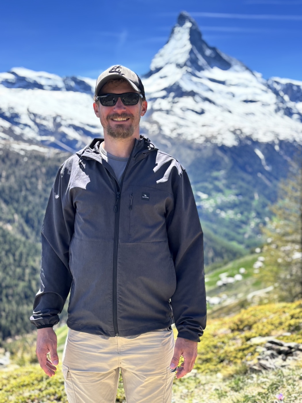 Jared standing in front of the Matterhorn on a clear day